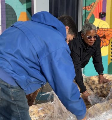 Volunteers for People's Place receive a delivery of produce from the Farm Hub.